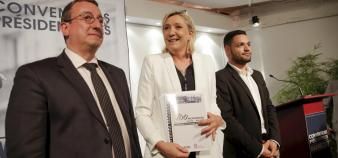Marine Le Pen, en septembre 2016, au lancement de sa campagne présidentielle, aux côtés de Daniel Auguste (au fond).